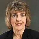 Professional portrait of a middle-aged woman with short hair.