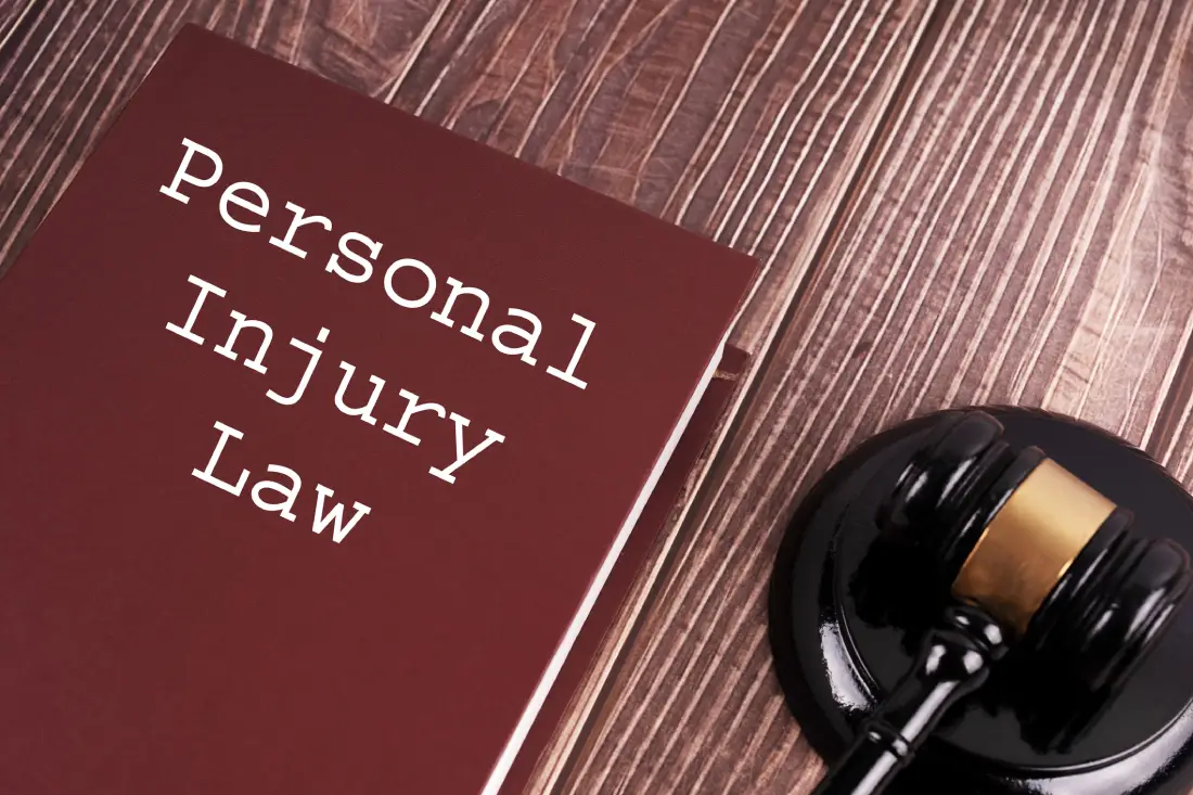 Personal injury law book and gavel.